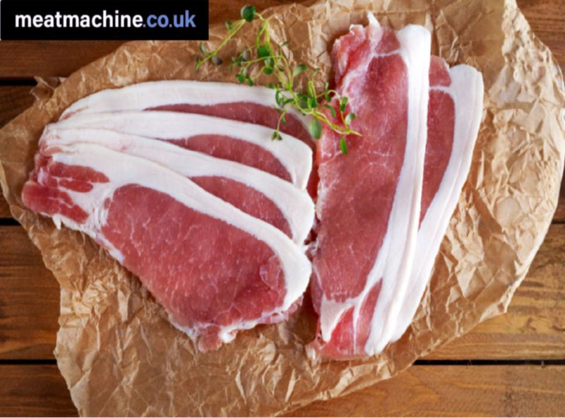 Raw unsmoked back bacon strips on brown paper with a sprig of thyme, placed on a wooden surface.