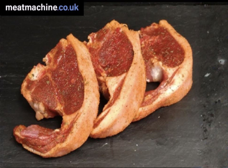 Three seasoned meat slices on a dark surface with 'meatmachine.co.uk' branding.