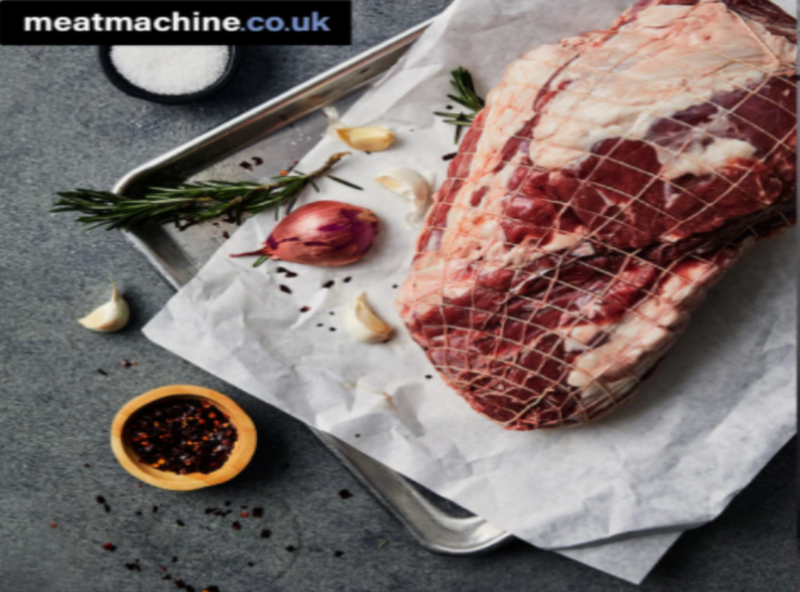 Boneless leg of lamb prepared by Bristol butcher with netting for roasting.
