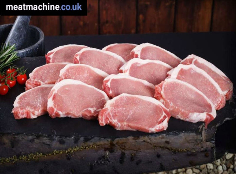 Raw boneless British pork loin steaks displayed on grill ready for cooking.
