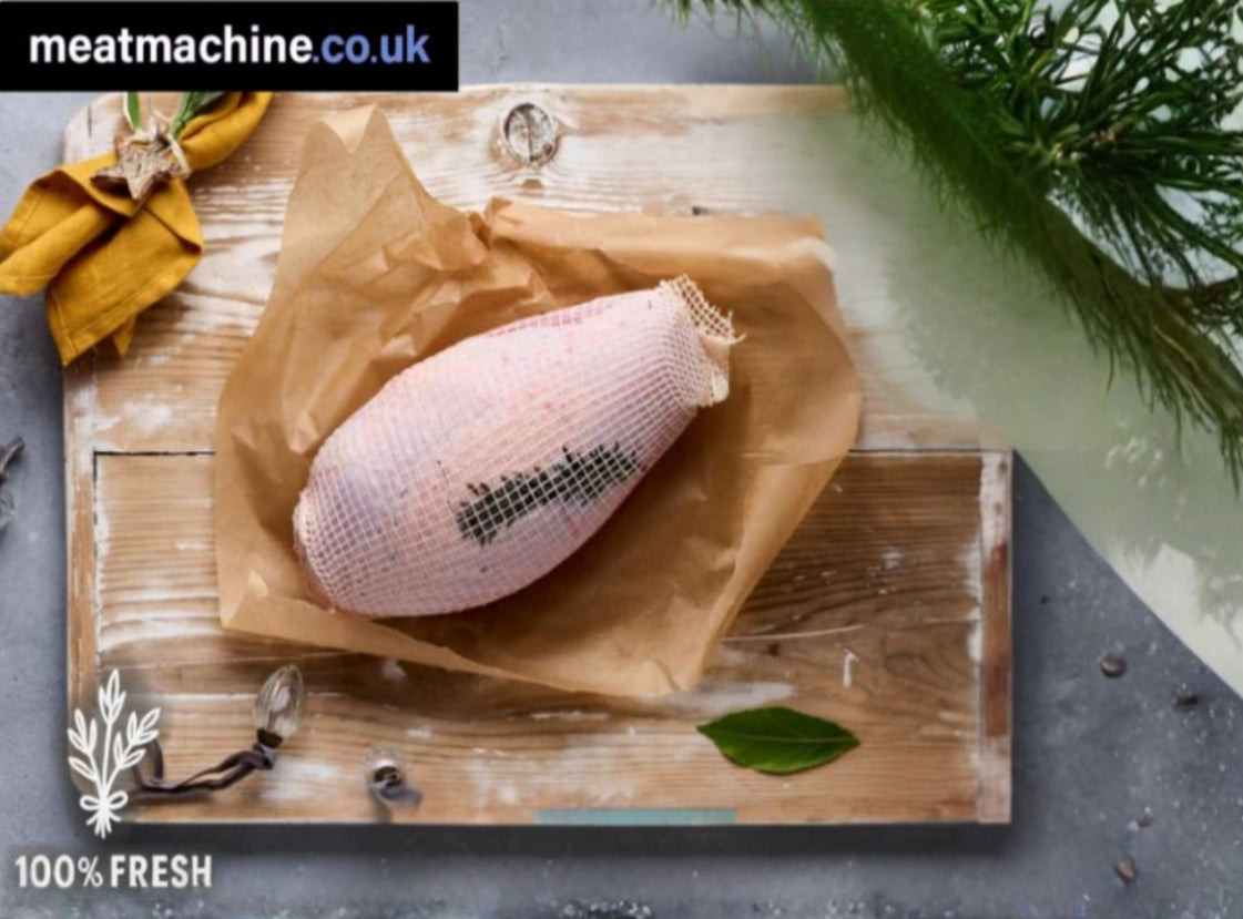 Raw meat product on brown paper with 'meatmachine.co.uk' branding and '100% Fresh' label.